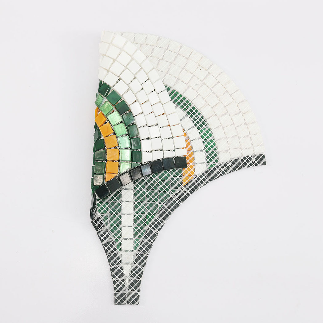 Back view of the mosaic tile showing white mesh adhesive backing.