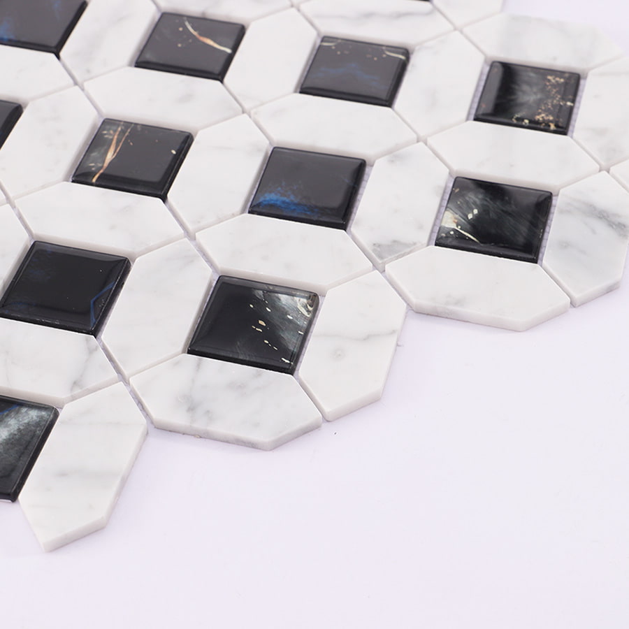 Side angle view of marble and black glass mosaic tiles.