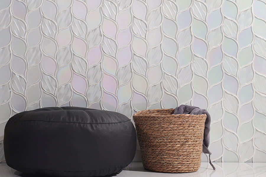 Mosaic tile splashback with flowing wave pattern in iridescent pearl and lavender colors