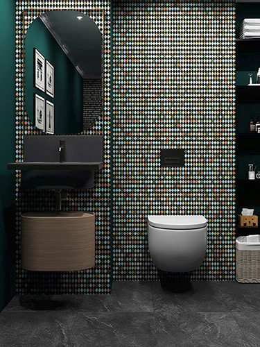 Colorful rhombus mosaic tile wall in a modern dark green bathroom