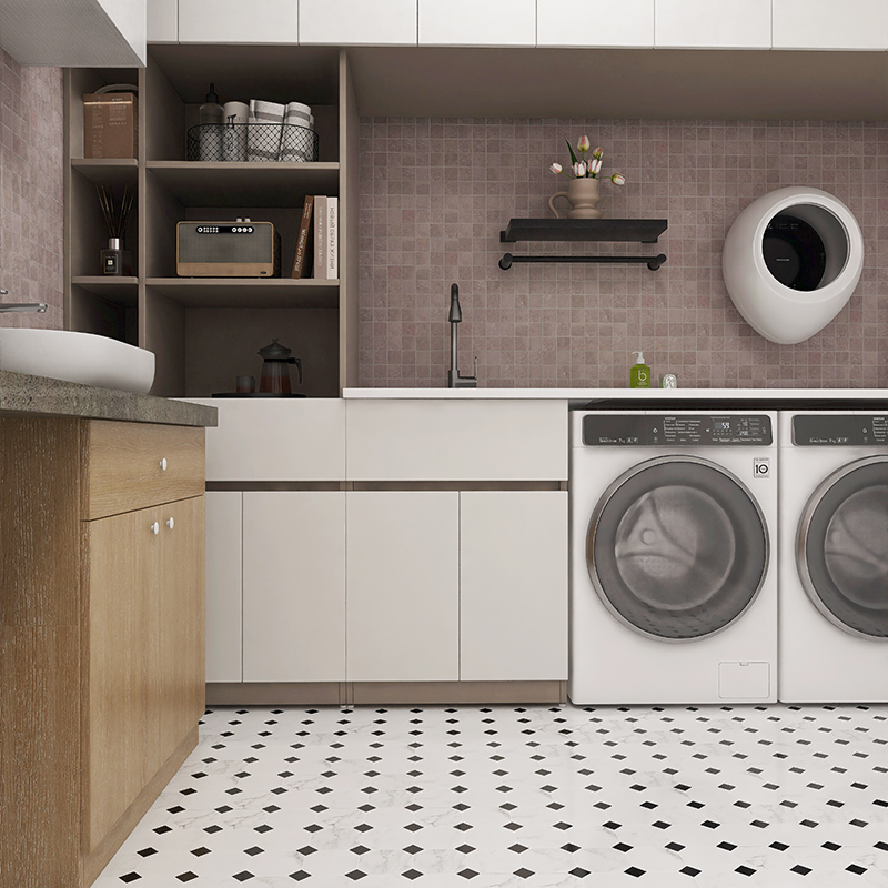 Laundry room with black and white octagon tiles and modern cabinetry.