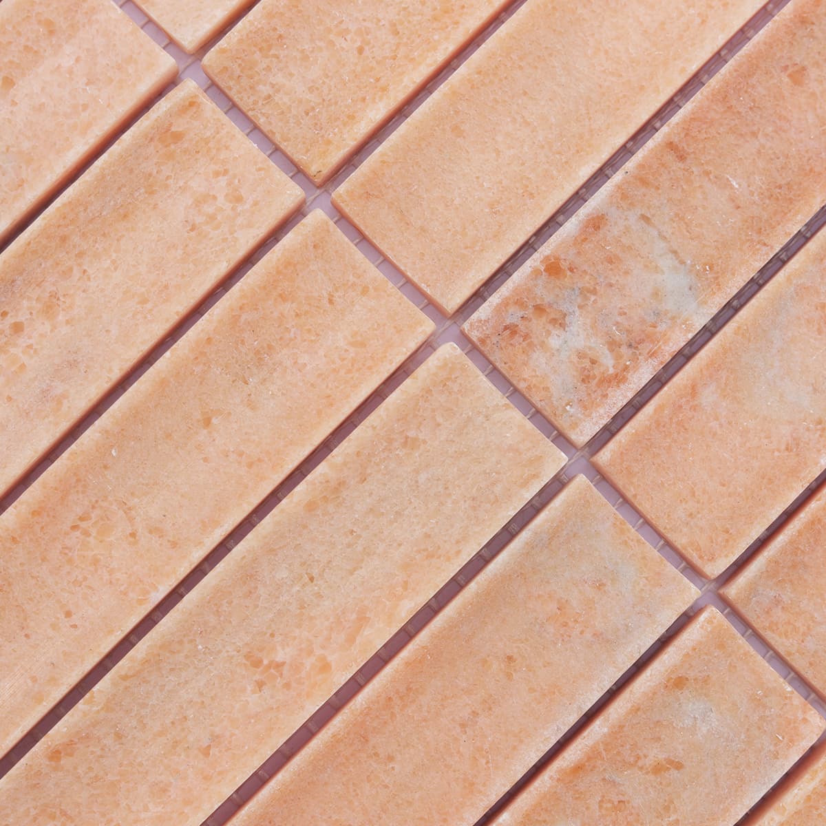 Surface texture detail of orange fluted stone mosaic tiles
