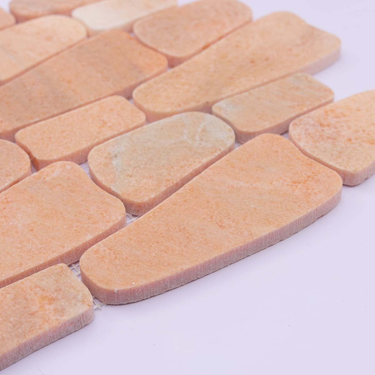 Side angle showing thickness of orange irregular mosaic stone