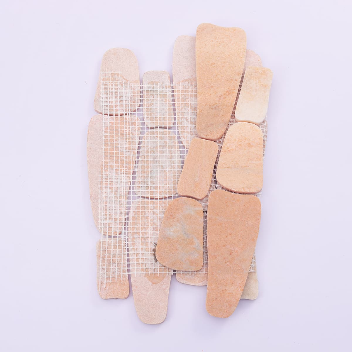 Mesh backing of irregular orange marble mosaic tile