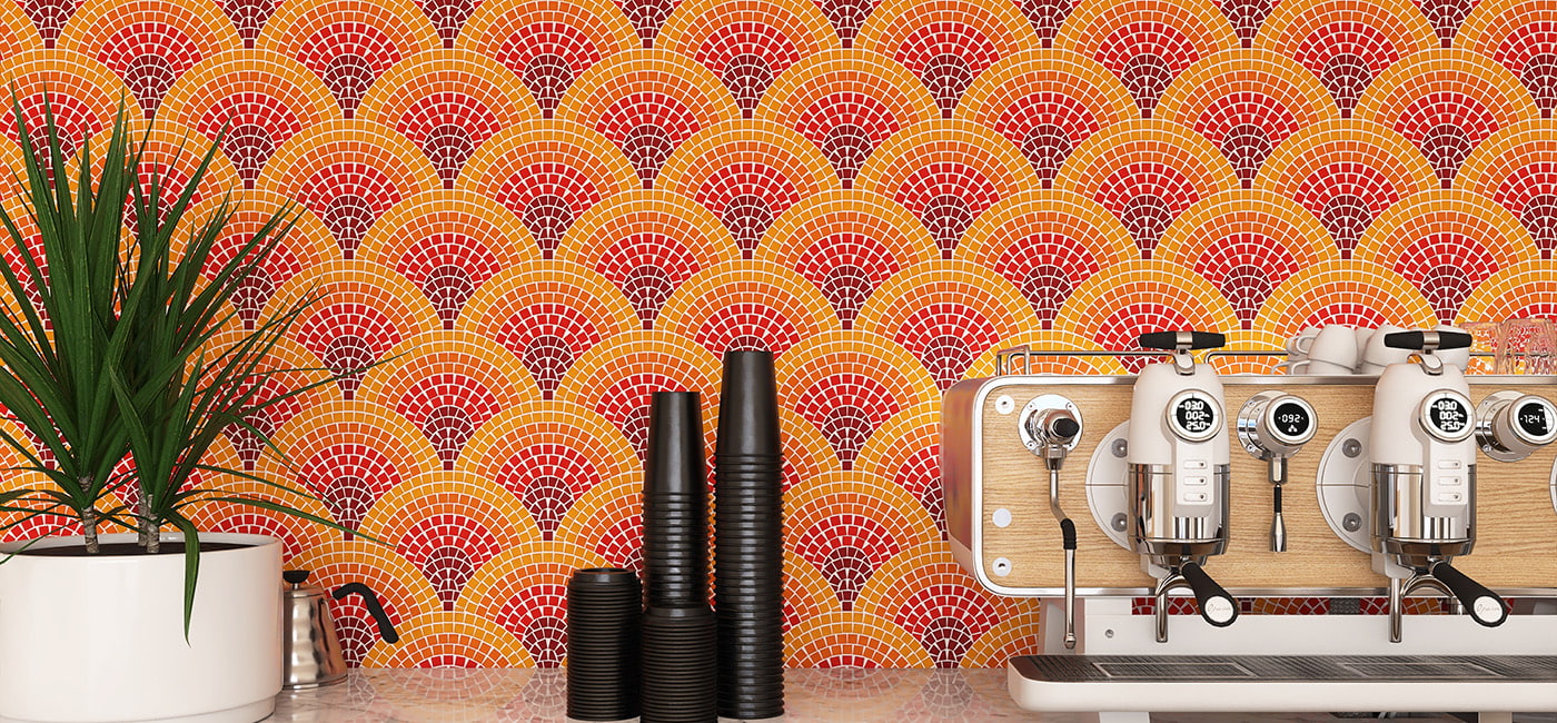 Orange and red fan mosaic tiles on a wide café backsplash wall