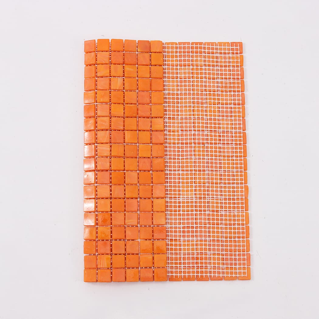 Orange peach square glass mosaic tile sheet showing front and mesh backing