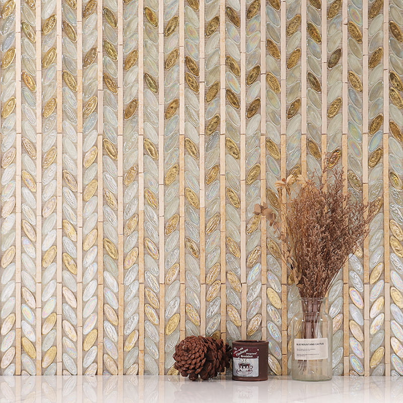 Oval glass tiles with gold leaf in a vertical herringbone leaf pattern