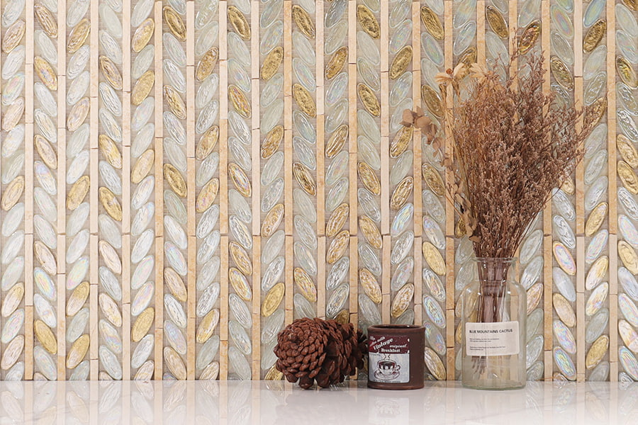Luxury oval glass tiles with iridescent finish and gold leaf in leaf-style layout