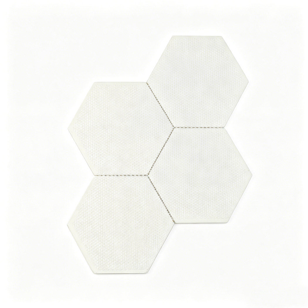 Back view of large white hexagon glass tile sheet with mesh mounted backing