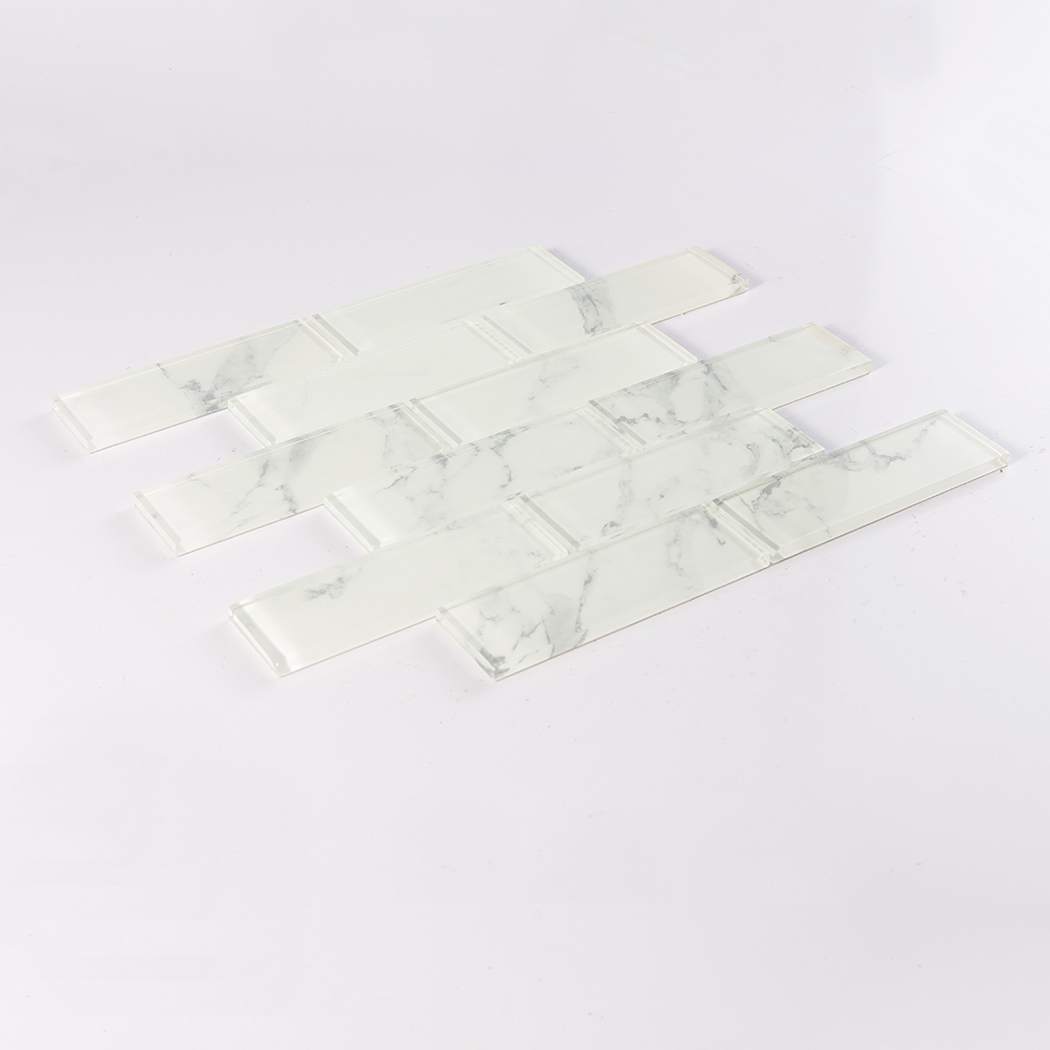 White marble glass subway tile sample laid flat with soft gray veining