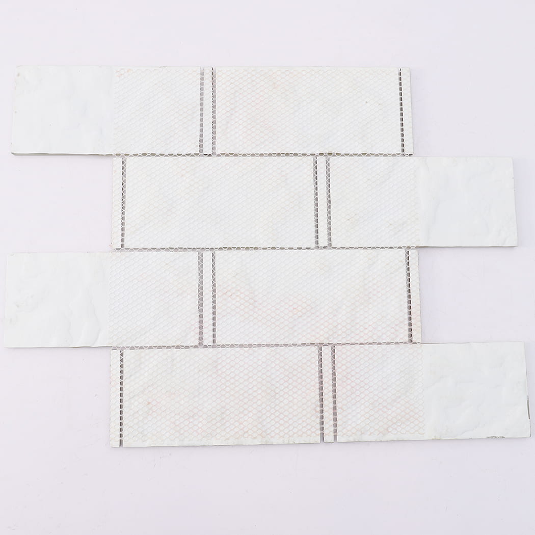Mesh backing of pale green glass subway mosaic tile sheet with glass accents