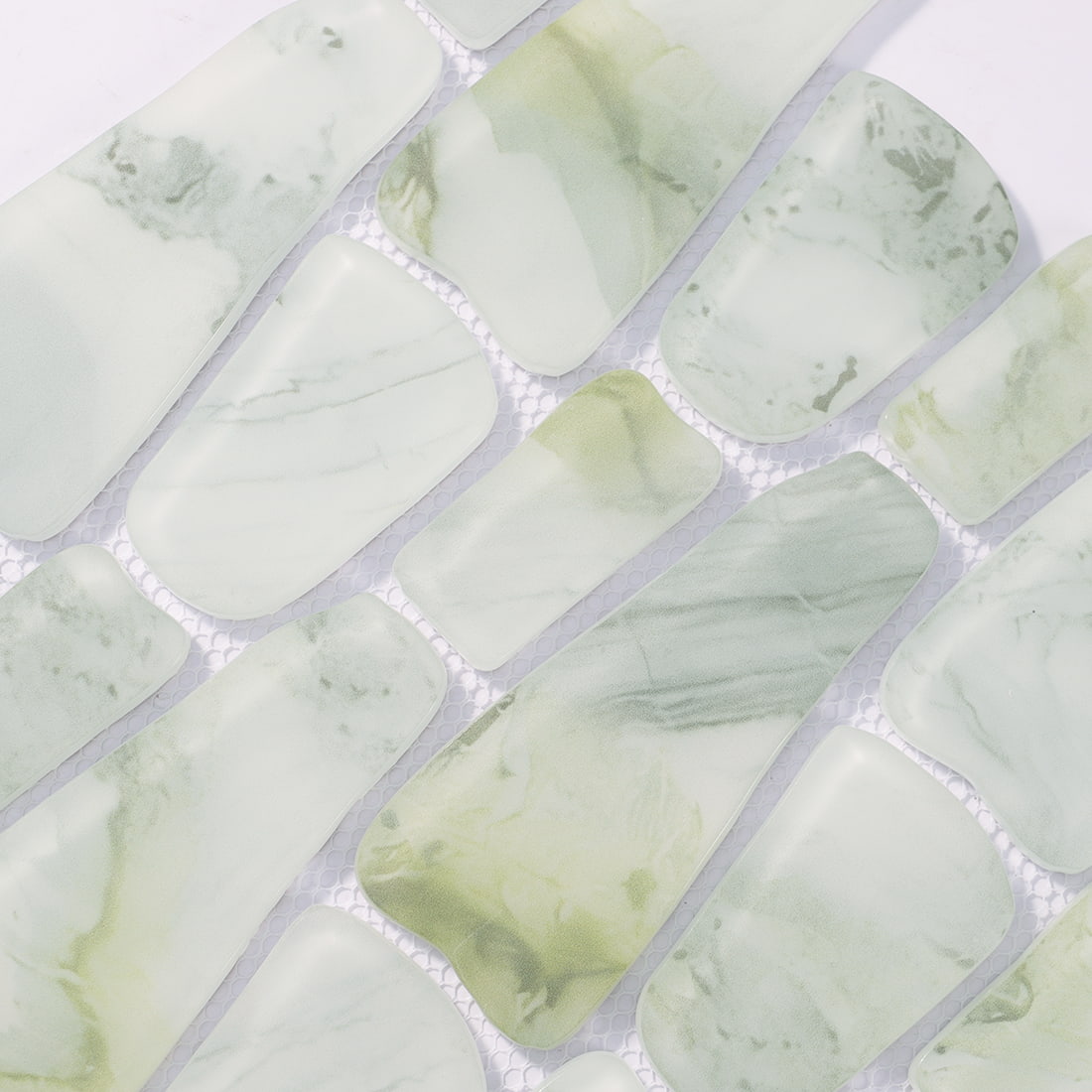 Pale green irregular glass mosaic tile surface with softly rounded pieces