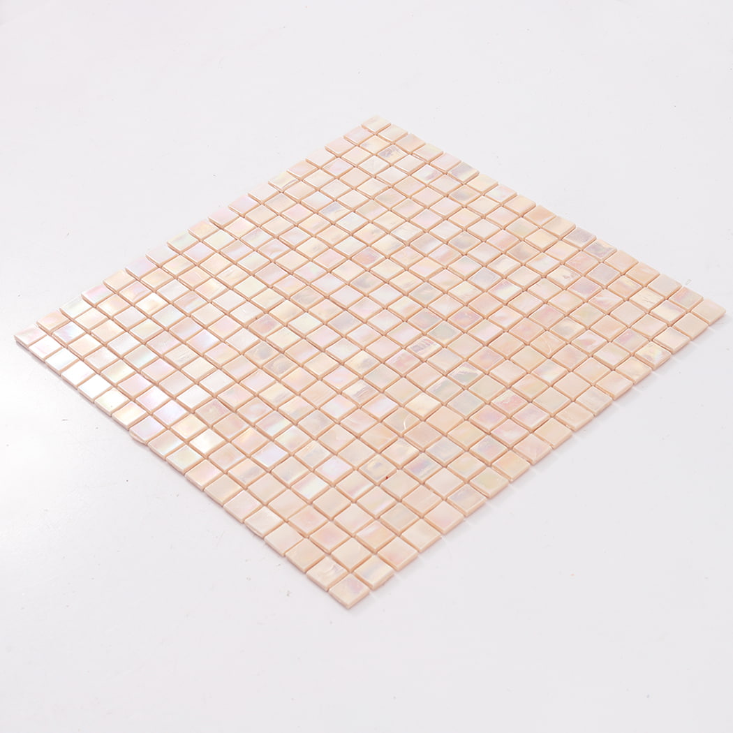 Angled view of a full pale pink iridescent square glass mosaic tile sheet