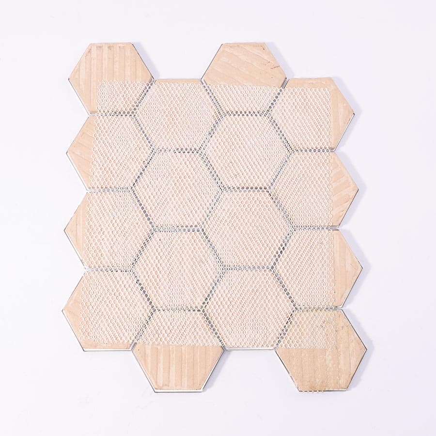Back view showing mesh backing of pattern printed silver hexagon aluminum tile