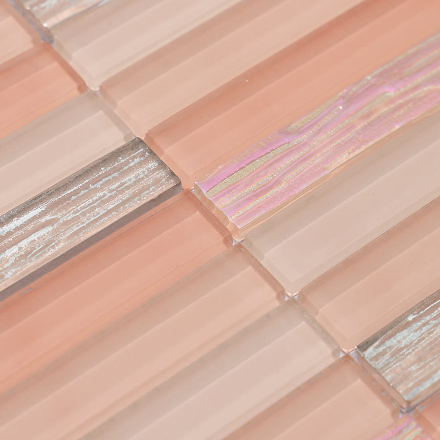 Close up pattern of peach pink and silver glass mosaic tile layout