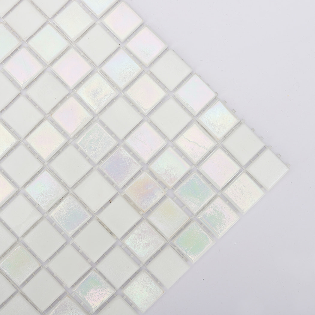 diagonal corner closeup of pearl white mosaic tiles with soft iridescent glow