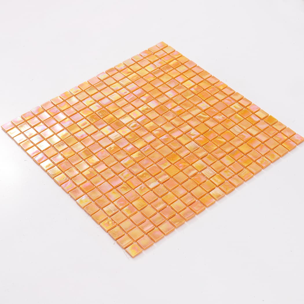 Angled view of a full pearlescent orange square glass mosaic tile sheet