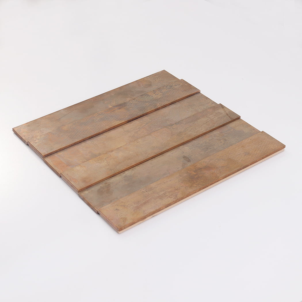 An angled perspective of a square copper-colored tile sheet laying on a white background.