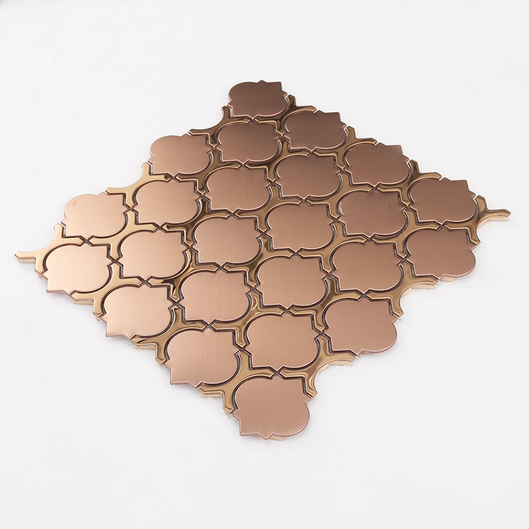 Perspective shot of a single interlocking rose gold arabesque mosaic tile sheet.