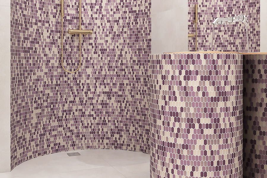 Modern bathroom with purple picket tiles on wall and sink