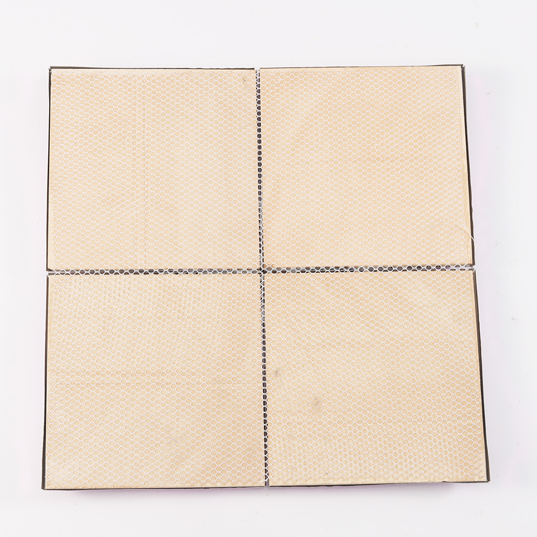 The back side of pink 3D metal tiles showing the mesh netting for easy installation.