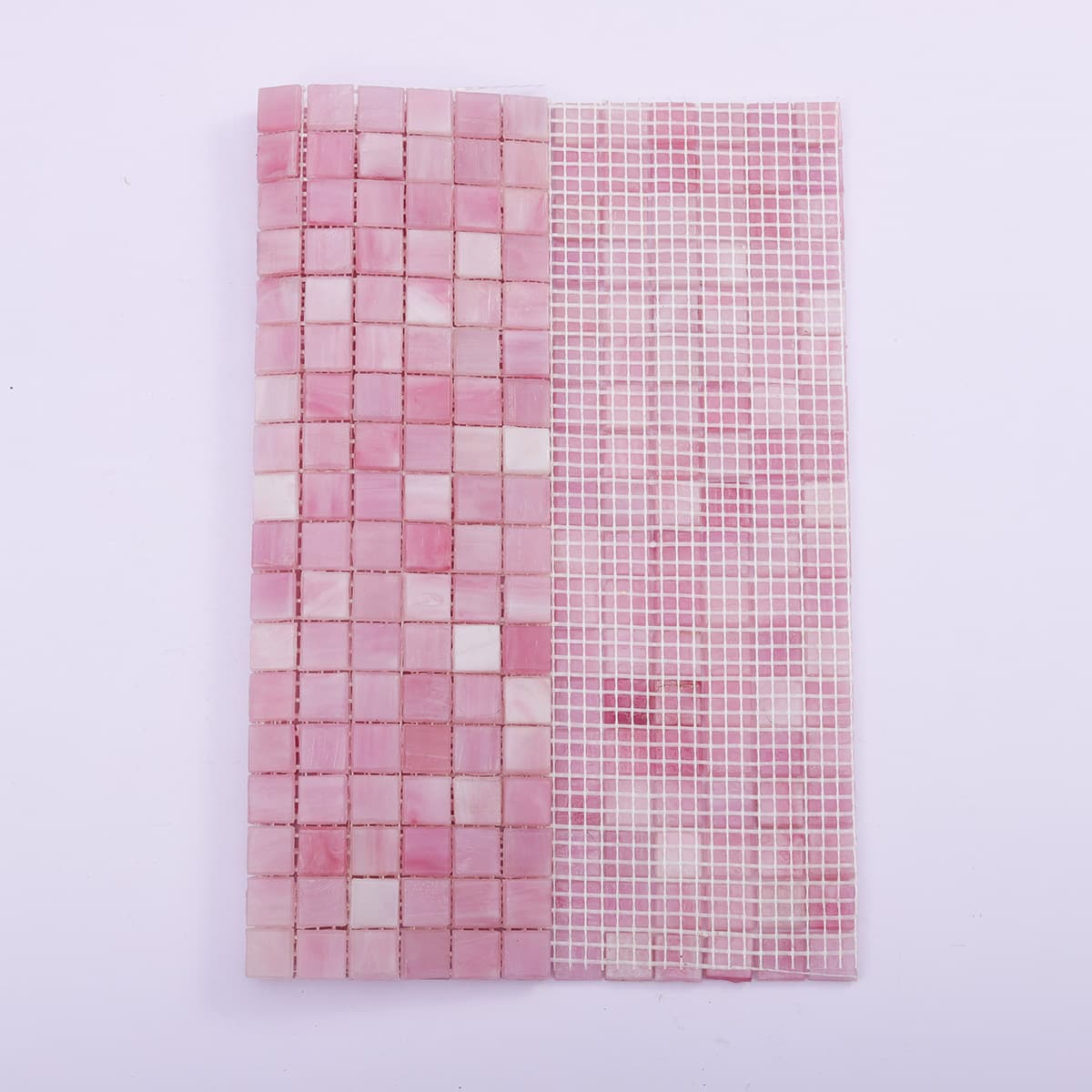 Comparison of the front and mesh-backed side of pink square glass mosaic tiles