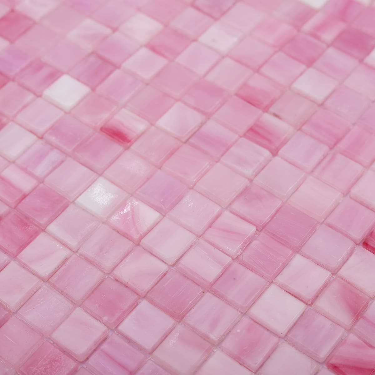  Angled close-up of pink square mosaic tiles with soft swirling patterns