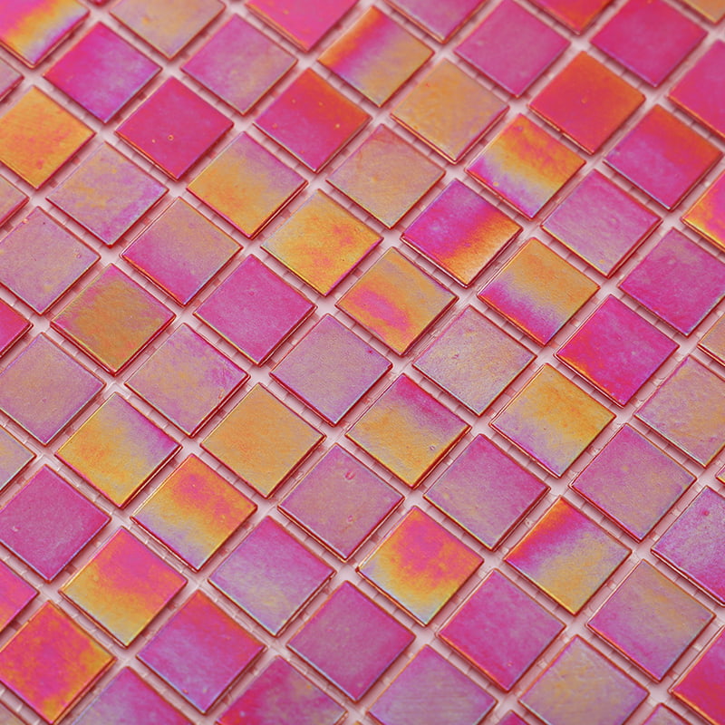  A close-up view of pink glass mosaic tiles with iridescent orange sheen