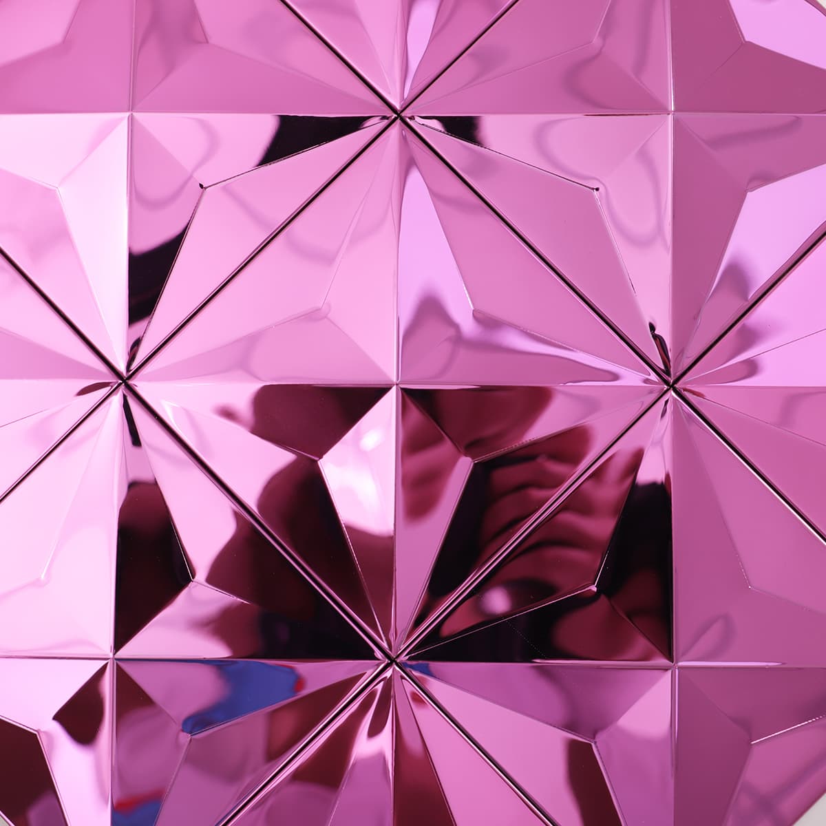 Reflective surface detail of pink 3D stainless steel mosaic