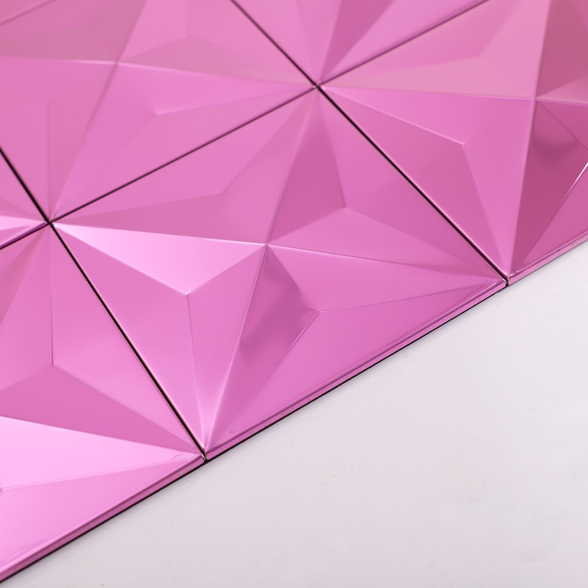 Edge close-up of pink mirror 3D stainless steel tile