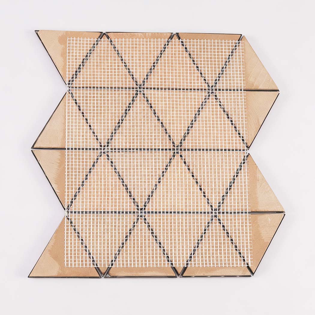 Back view of pink triangle metal mosaic tile sheet with mesh mounting