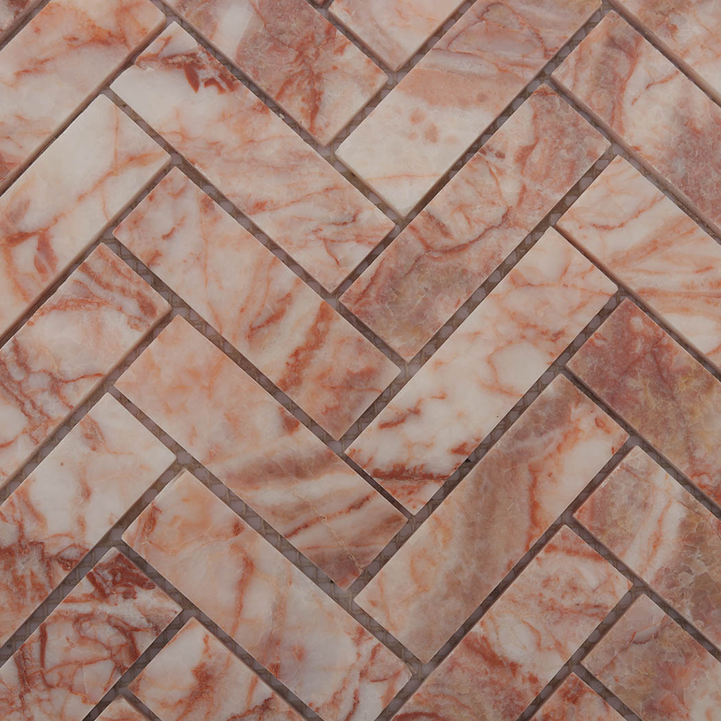 Detailed surface of polished pink and white marble herringbone mosaic tile