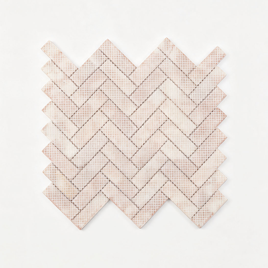 Mesh-backed reverse side of pink and white herringbone marble mosaic tile