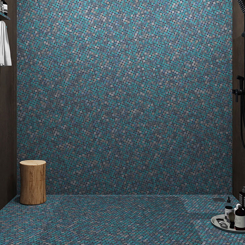 Pinwheel tile pattern glass mosaic in a vertical shower wall