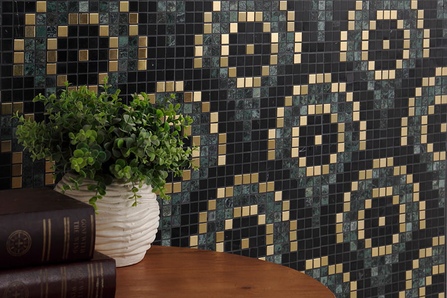 Decorative wall with black and gold pixel tiles featuring circular glass mosaic design