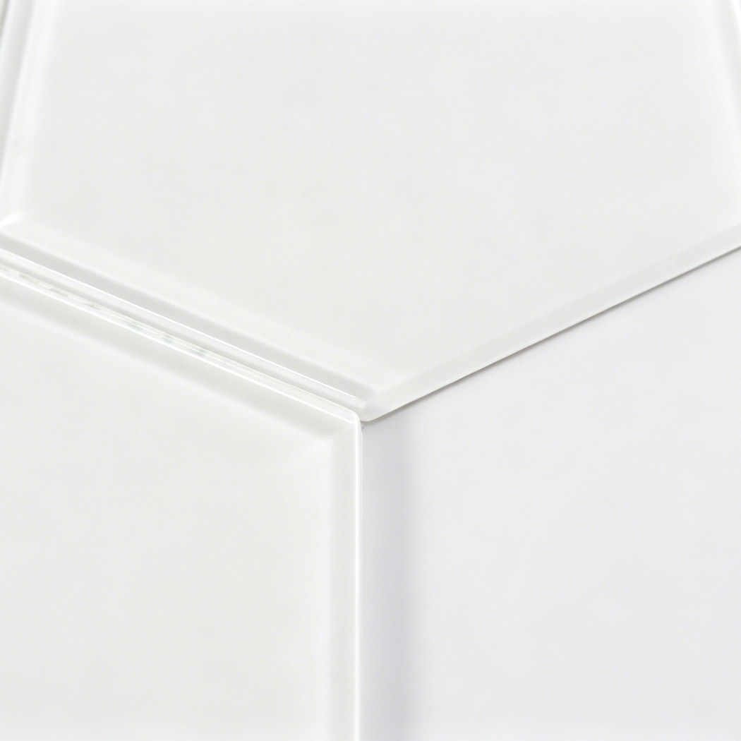 Minimal close up of plain white hexagon glass tile with clear beveled edge