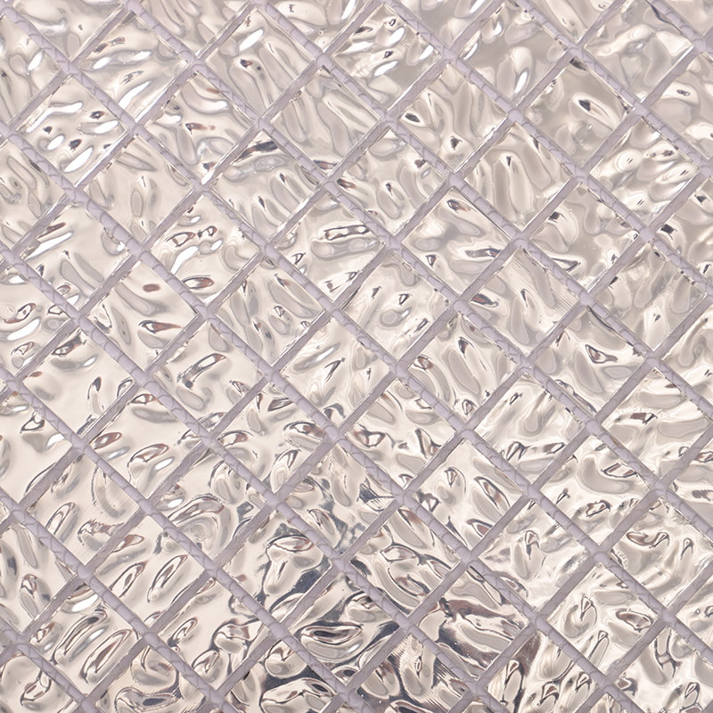 shimmering pressed silver glass mosaic tiles in close-up