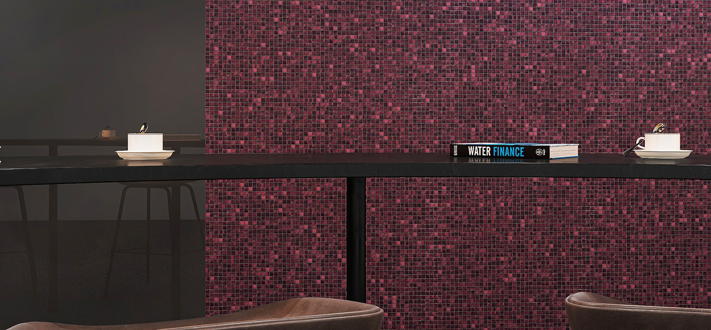 Wide shot of a modern seating area in front of a purple iridescent glass mosaic tile wall 