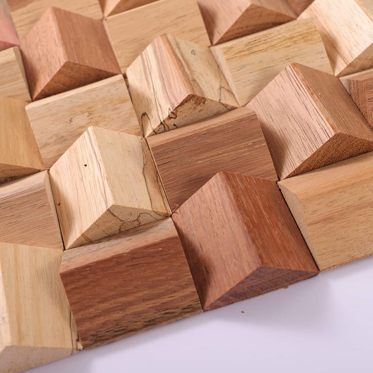 Side view of pyramid wood tiles highlighting raised 3D peaks