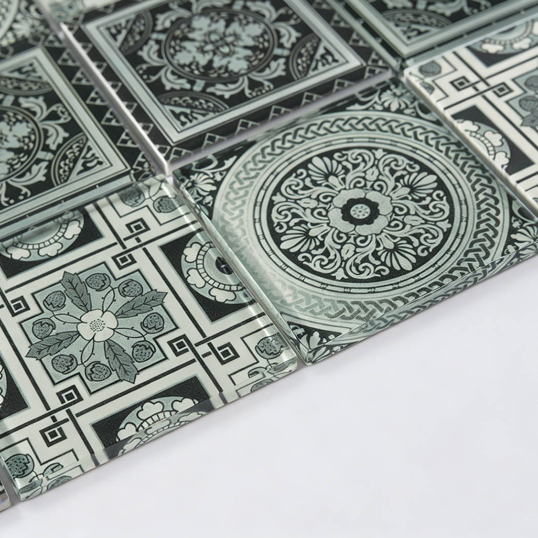 Raised black and white decorative glass mosaic surface with vintage motifs