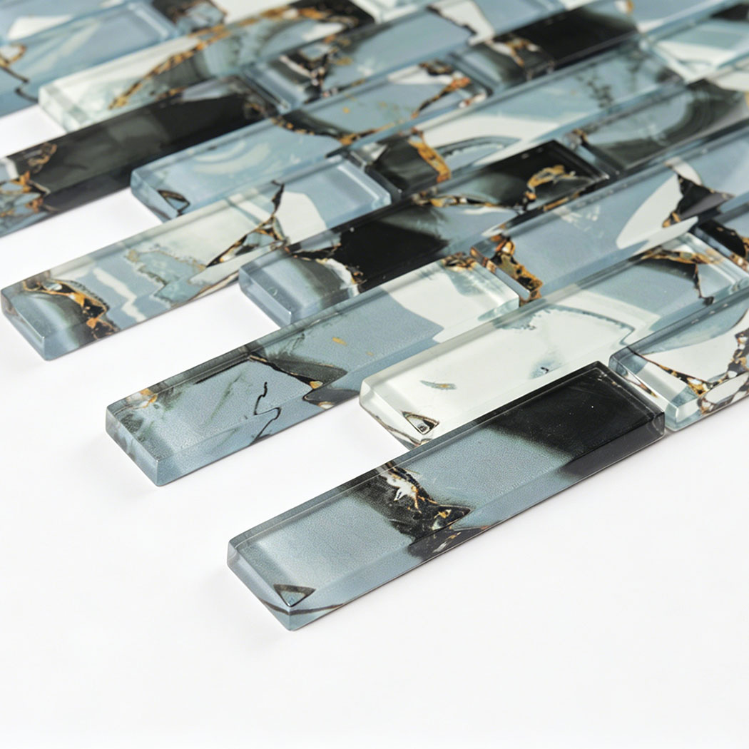Close-up of glossy blue gray glass subway mosaic with black white and gold veining