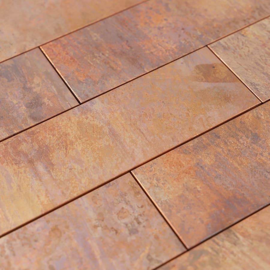 Angled view showing surface texture of copper mosaic tiles