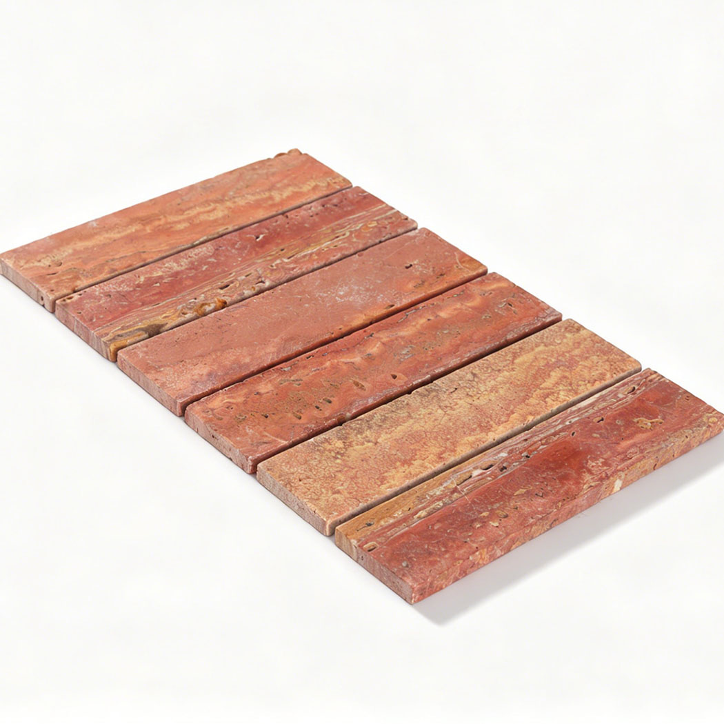 Angled view of a red linear travertine mosaic sheet with varied natural patterns
