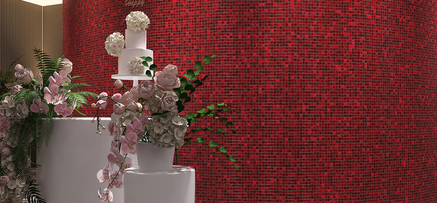 Wide shot of a curved red mosaic tile wall adorned with a multi-tier floral display