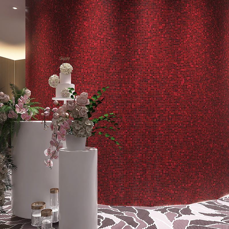 Vertical view of a curved red mosaic tile wall accented by white floral vases