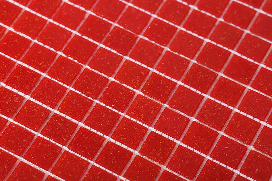 Grid pattern of small red glass square mosaic tiles on white mesh