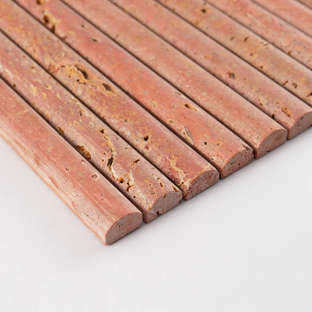 Side view of red travertine half cylinder mosaic tile showing rounded raised edges