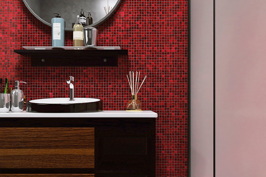 Red Wall Tiles made of glass mosaic creating a bold backsplash in a modern bathroom.