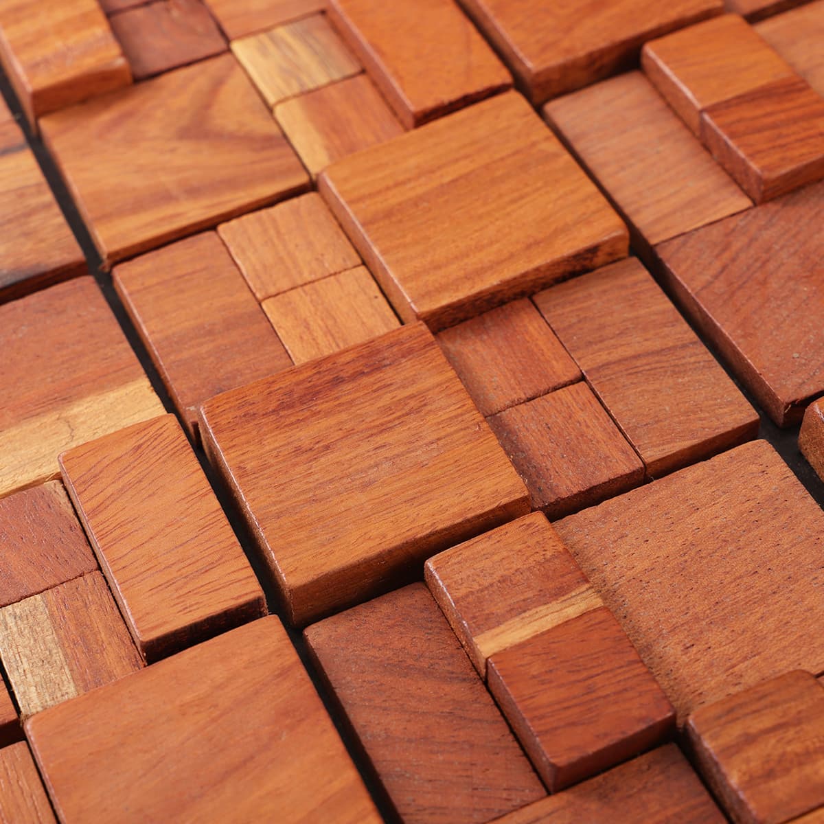 Detail of reddish wooden mosaic blocks with textured surface