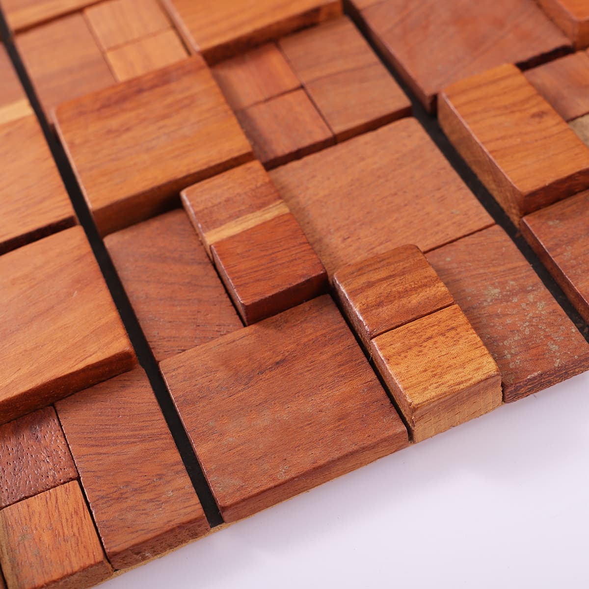 Close-up of layered red wood mosaic with varied depth